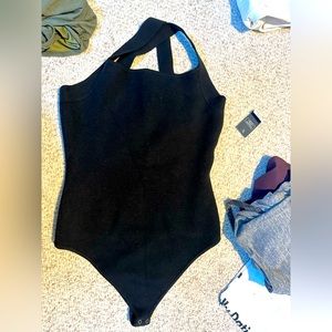 Black cross over back body suit from Abercrombie, has a sweater like material